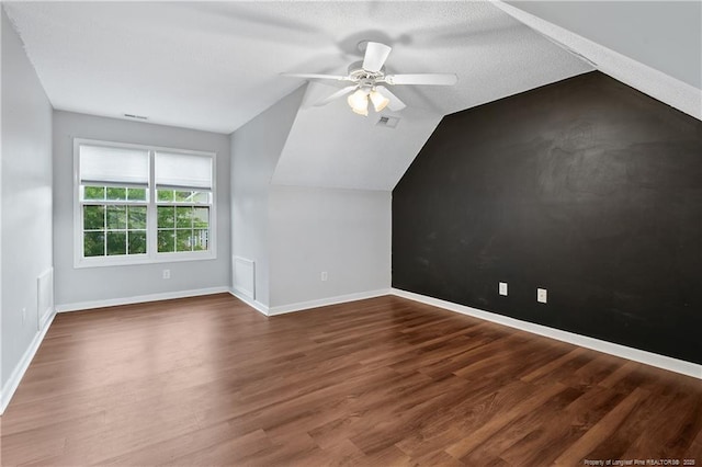 4420 Battle Forest Rd, Hope Mills, NC 28348 - additional living space featuring vaulted ceiling, ceiling fan, wood finished floors, and baseboards