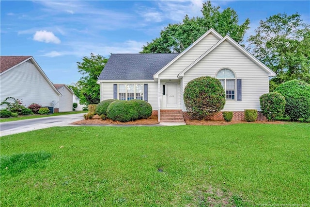1502 E 11th St, Lumberton, NC 28358 - single story home with a front yard, concrete driveway, and roof with shingles