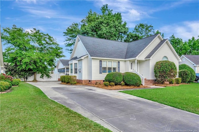 1502 E 11th St, Lumberton, NC 28358 - view of front of house featuring concrete driveway, crawl space, a shingled roof, and a front yard