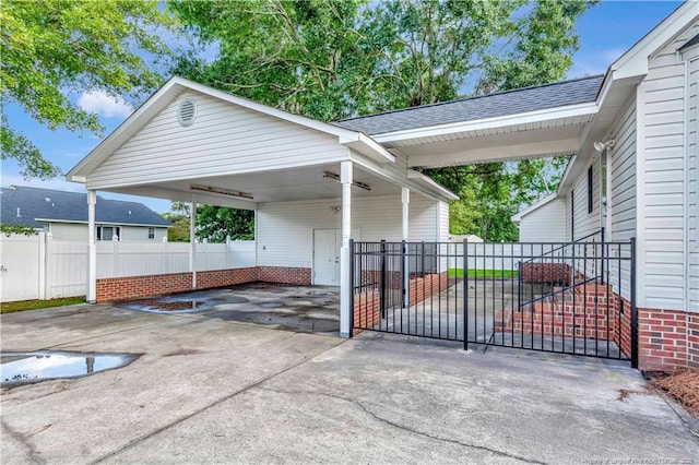 1502 E 11th St, Lumberton, NC 28358 - view of car parking with concrete driveway and a carport