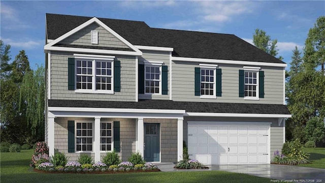 273 Hartfield Ave, Raeford, NC 28376 - view of front of home with an attached garage, concrete driveway, and a front yard