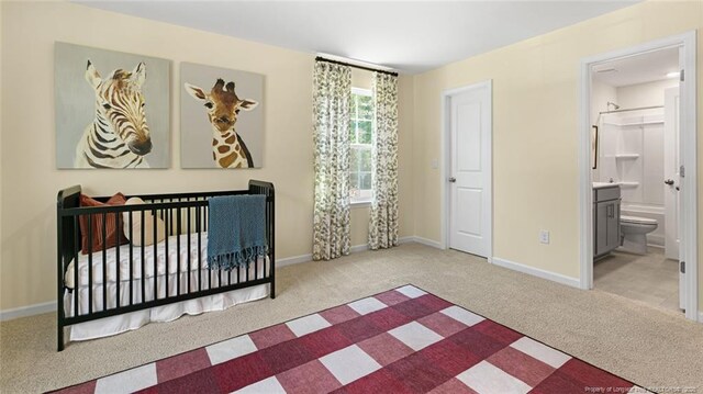 273 Hartfield Ave, Raeford, NC 28376 - bedroom with carpet flooring, baseboards, and connected bathroom