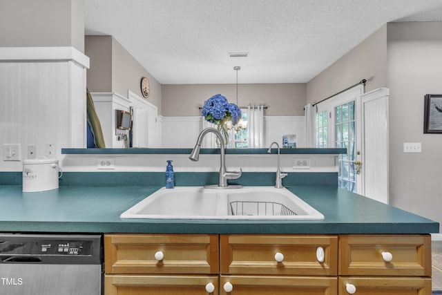 120 Feezor Ct, Clayton, NC 27527 - kitchen with stainless steel dishwasher, a textured ceiling, and dark countertops