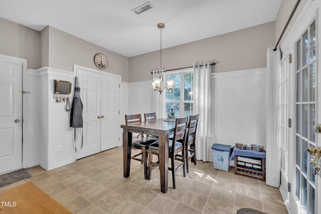 120 Feezor Ct, Clayton, NC 27527 - dining space with a chandelier and a textured ceiling