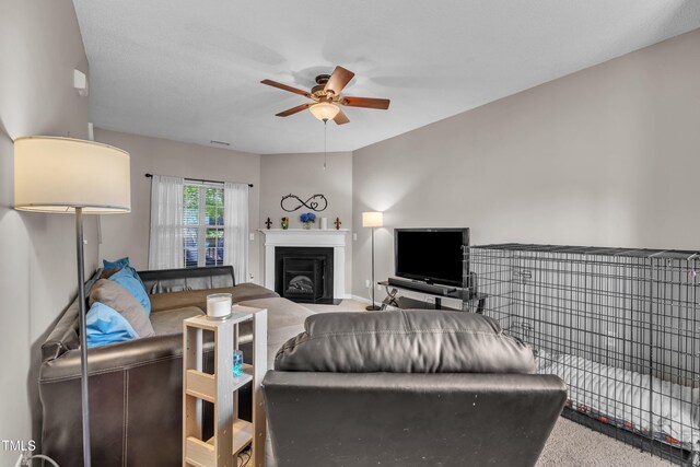 120 Feezor Ct, Clayton, NC 27527 - carpeted living room featuring ceiling fan and a fireplace with flush hearth