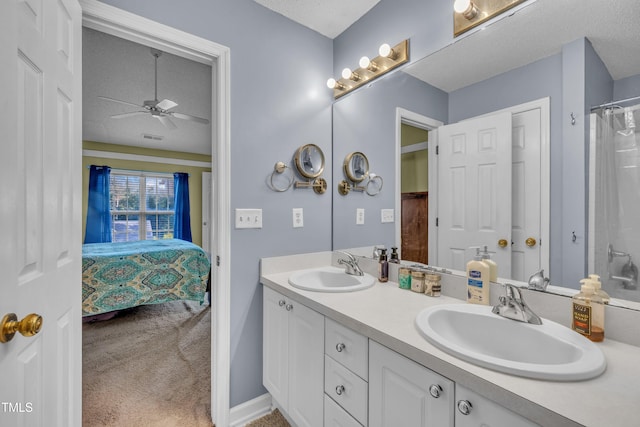 120 Feezor Ct, Clayton, NC 27527 - bathroom with ceiling fan, double vanity, ensuite bath, and a textured ceiling