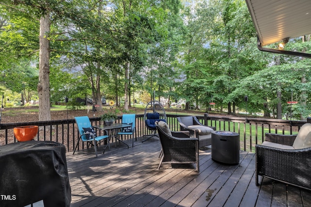 120 Feezor Ct, Clayton, NC 27527 - deck with view of scattered trees, outdoor dining space, and a grill