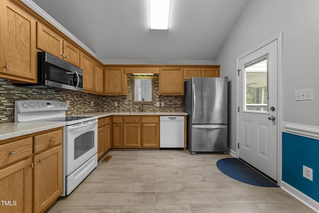 1383 Deercroft Ct, Graham, NC 27253 - kitchen featuring stainless steel appliances, backsplash, a sink, light countertops, and lofted ceiling