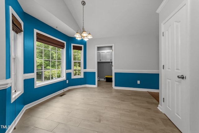 1383 Deercroft Ct, Graham, NC 27253 - spare room with a chandelier, lofted ceiling, and baseboards