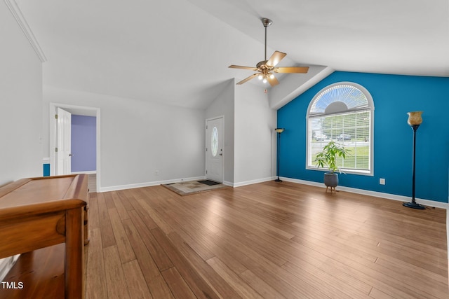 1383 Deercroft Ct, Graham, NC 27253 - unfurnished living room featuring ceiling fan, vaulted ceiling, baseboards, and wood finished floors