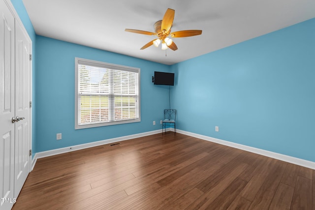1383 Deercroft Ct, Graham, NC 27253 - unfurnished room with ceiling fan, wood finished floors, and baseboards