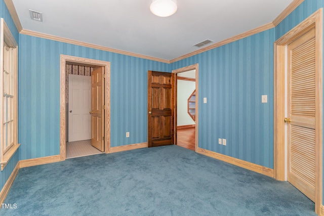 610 Walnut Creek Dr, Goldsboro, NC 27534 - unfurnished bedroom featuring carpet, ornamental molding, baseboards, and wallpapered walls
