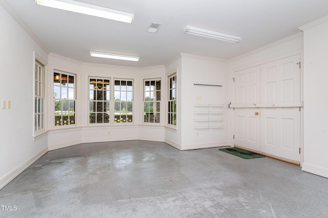 610 Walnut Creek Dr, Goldsboro, NC 27534 - empty room featuring baseboards, crown molding, and concrete flooring