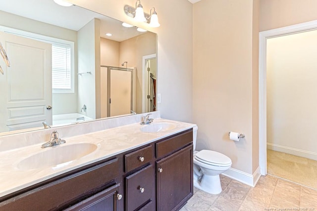 95 Taft Ln, Cameron, NC 28326 - full bath featuring a stall shower, a bath, double vanity, baseboards, and toilet