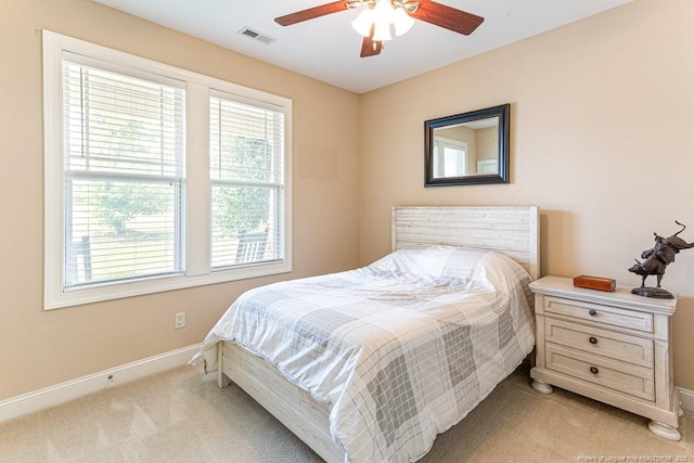 95 Taft Ln, Cameron, NC 28326 - bedroom with light carpet, multiple windows, baseboards, and a ceiling fan