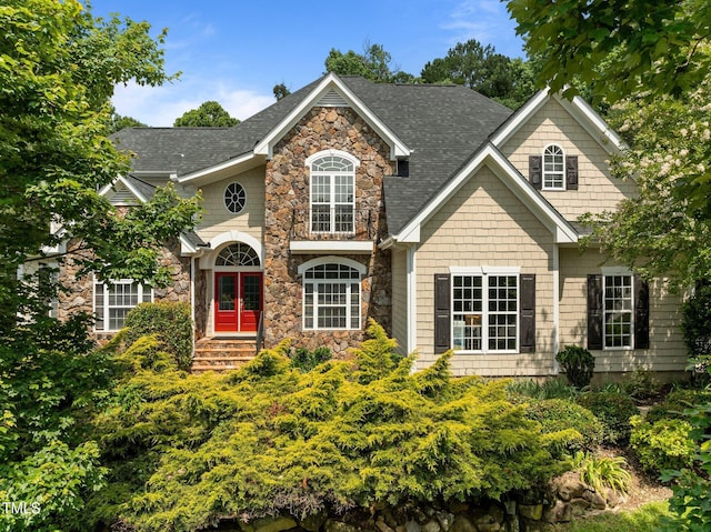 109 San Juan Dr, Chapel Hill, NC 27514 - view of front of home with stone siding and roof with shingles