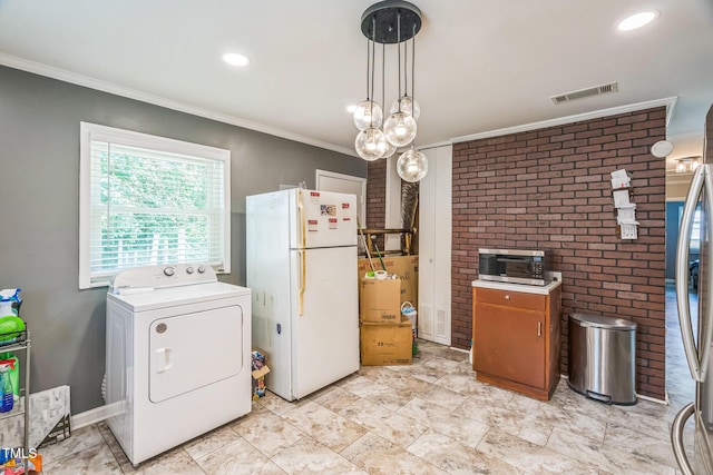 428 Walton St, Durham, NC 27703 - kitchen featuring washer / clothes dryer, appliances with stainless steel finishes, crown molding, light countertops, and pendant lighting