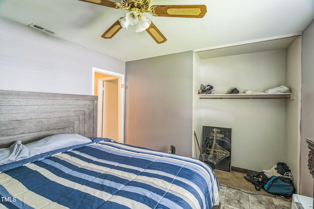 428 Walton St, Durham, NC 27703 - bedroom featuring a ceiling fan and stone finish floors