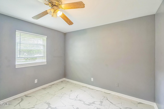 428 Walton St, Durham, NC 27703 - unfurnished room with light marble finish floors, baseboards, and ceiling fan