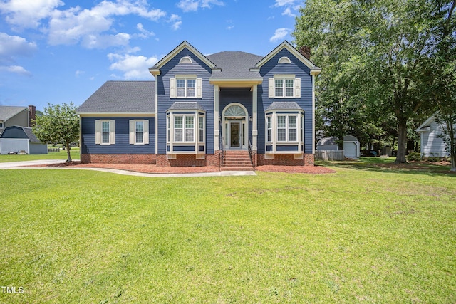 104 Goldleaf Ct, Angier, NC 27501 - view of front facade featuring a front yard, a shingled roof, and crawl space