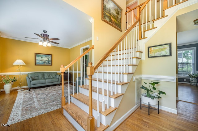 104 Goldleaf Ct, Angier, NC 27501 - stairs with wood finished floors, baseboards, ceiling fan, and crown molding