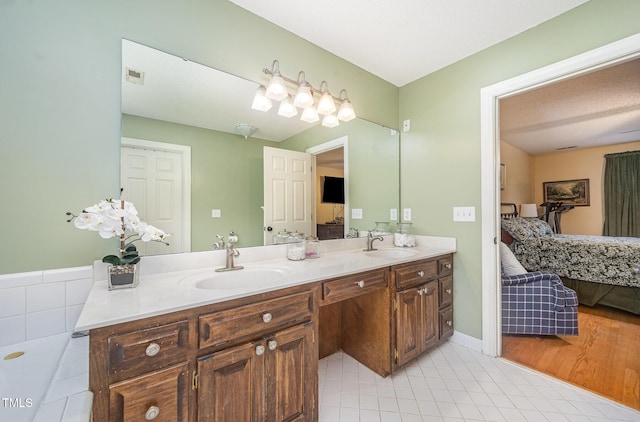104 Goldleaf Ct, Angier, NC 27501 - ensuite bathroom featuring double vanity and tile patterned floors