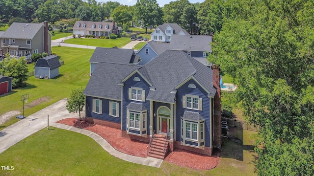 104 Goldleaf Ct, Angier, NC 27501 - traditional home featuring driveway, a residential view, and a shingled roof