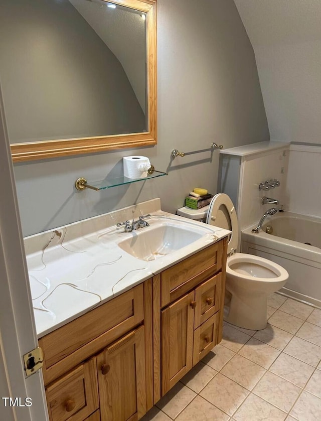 300 Christmas Rd, Warrenton, NC 27589 - full bath featuring tile patterned flooring, a bath, vanity, and vaulted ceiling