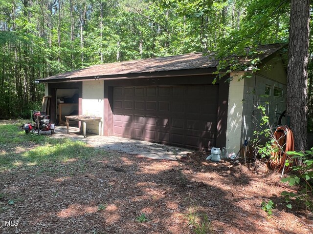 300 Christmas Rd, Warrenton, NC 27589 - detached garage with a forest view