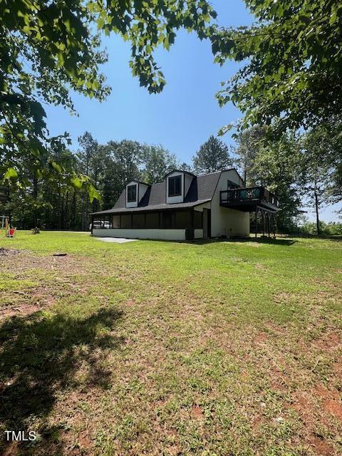 300 Christmas Rd, Warrenton, NC 27589 - back of house with a lawn and a wooden deck