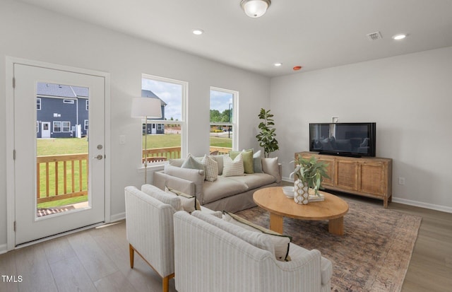 1525 Tamarisk Ln, Durham, NC 27703 - living area with light wood-style flooring, baseboards, and recessed lighting