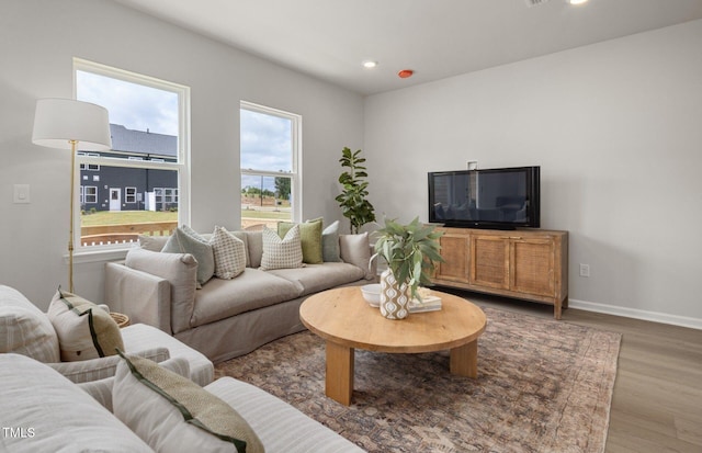 1525 Tamarisk Ln, Durham, NC 27703 - living area featuring wood finished floors, recessed lighting, and baseboards