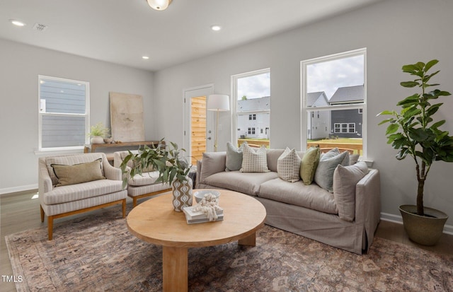 1525 Tamarisk Ln, Durham, NC 27703 - living room featuring baseboards, wood finished floors, and recessed lighting