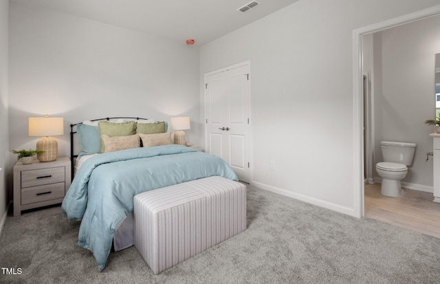 1525 Tamarisk Ln, Durham, NC 27703 - bedroom featuring carpet, baseboards, and ensuite bathroom