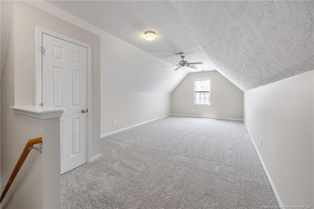 5511 Shady Lawn Dr, Hope Mills, NC 28348 - bonus room featuring carpet floors, a textured ceiling, vaulted ceiling, baseboards, and a ceiling fan