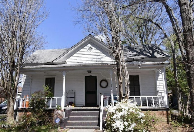 1301 E Jones St, Raleigh, NC 27610 - view of front facade featuring covered porch and roof with shingles