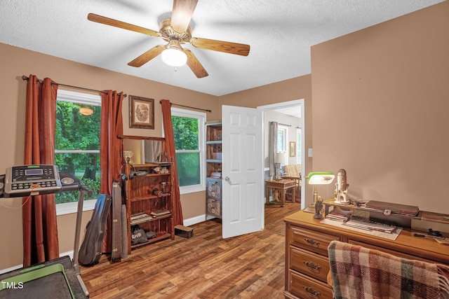 1869 Brevard Rd, Graham, NC 27253 - office space featuring wood finished floors, healthy amount of natural light, ceiling fan, and a textured ceiling