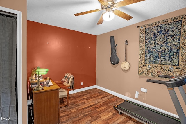1869 Brevard Rd, Graham, NC 27253 - workout room with wood finished floors, ceiling fan, baseboards, and a textured ceiling