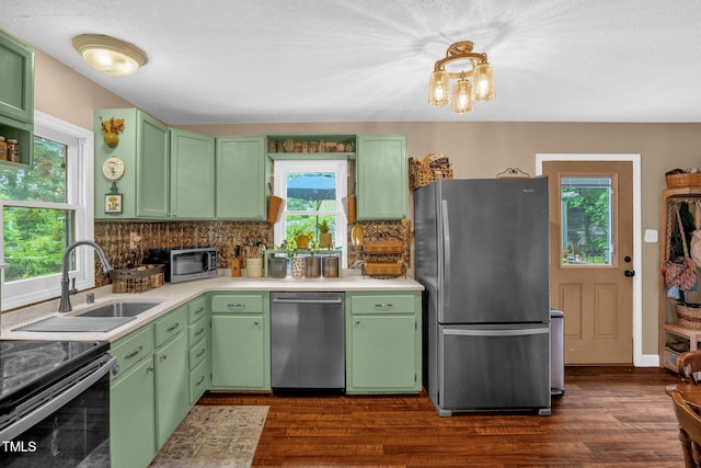 1869 Brevard Rd, Graham, NC 27253 - kitchen featuring appliances with stainless steel finishes, tasteful backsplash, a sink, and green cabinetry