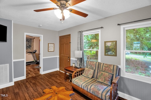 1869 Brevard Rd, Graham, NC 27253 - sitting room featuring wood finished floors, a textured ceiling, ceiling fan, and baseboards