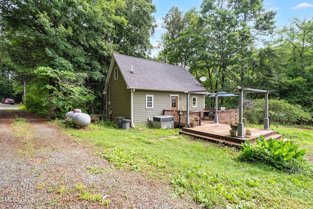1869 Brevard Rd, Graham, NC 27253 - back of property with a deck, a shingled roof, and driveway