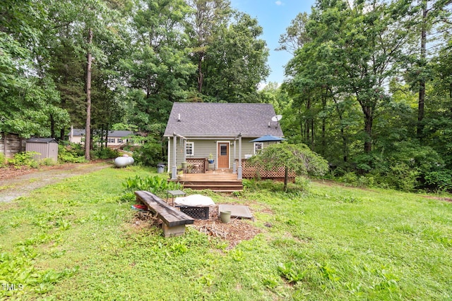 1869 Brevard Rd, Graham, NC 27253 - view of front of home with a deck, a front yard, and a shingled roof