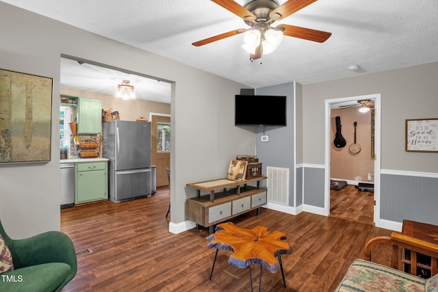 1869 Brevard Rd, Graham, NC 27253 - living room with dark wood-style floors, ceiling fan, a textured ceiling, and baseboards