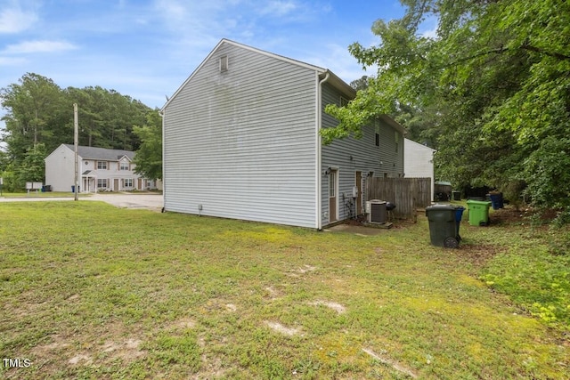 1824 Vintage Rd, Raleigh, NC 27610 - view of home's exterior with a yard and central AC unit