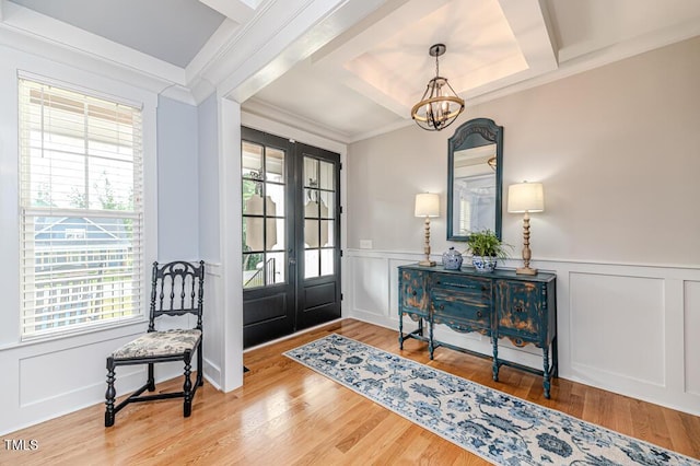 104 Crosby Ln, Sanford, NC 27330 - foyer entrance featuring a chandelier, a decorative wall, ornamental molding, a wainscoted wall, and wood finished floors