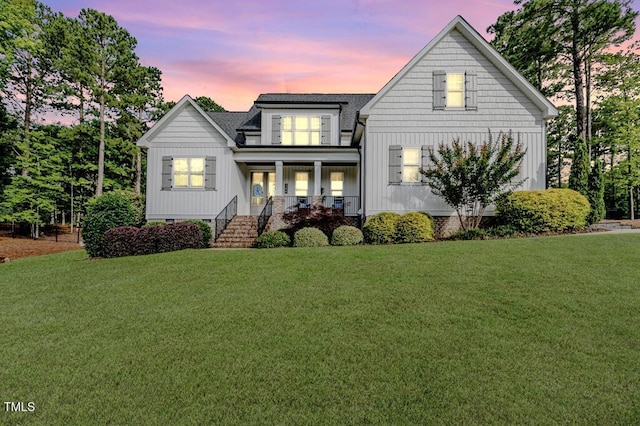 104 Crosby Ln, Sanford, NC 27330 - modern farmhouse style home with a porch, a front lawn, roof with shingles, and board and batten siding