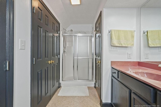 1314 Four Wood Dr, Fayetteville, NC 28312 - bathroom with a shower stall, vanity, and a textured ceiling