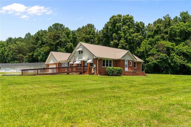 472 Walter Bright Rd, Sanford, NC 27330 - view of front facade featuring brick siding, a front lawn, a garage, and a view of trees