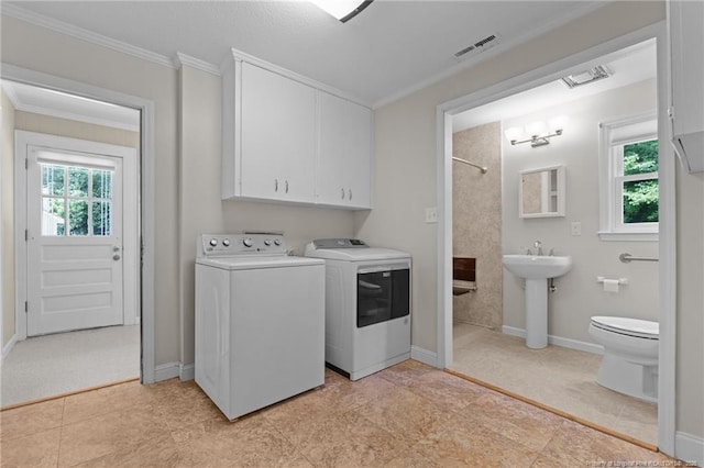 472 Walter Bright Rd, Sanford, NC 27330 - laundry room featuring washing machine and clothes dryer, ornamental molding, plenty of natural light, and baseboards