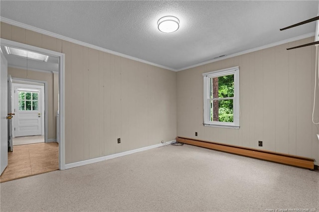 472 Walter Bright Rd, Sanford, NC 27330 - empty room with a baseboard heating unit, attic access, baseboards, crown molding, and carpet floors